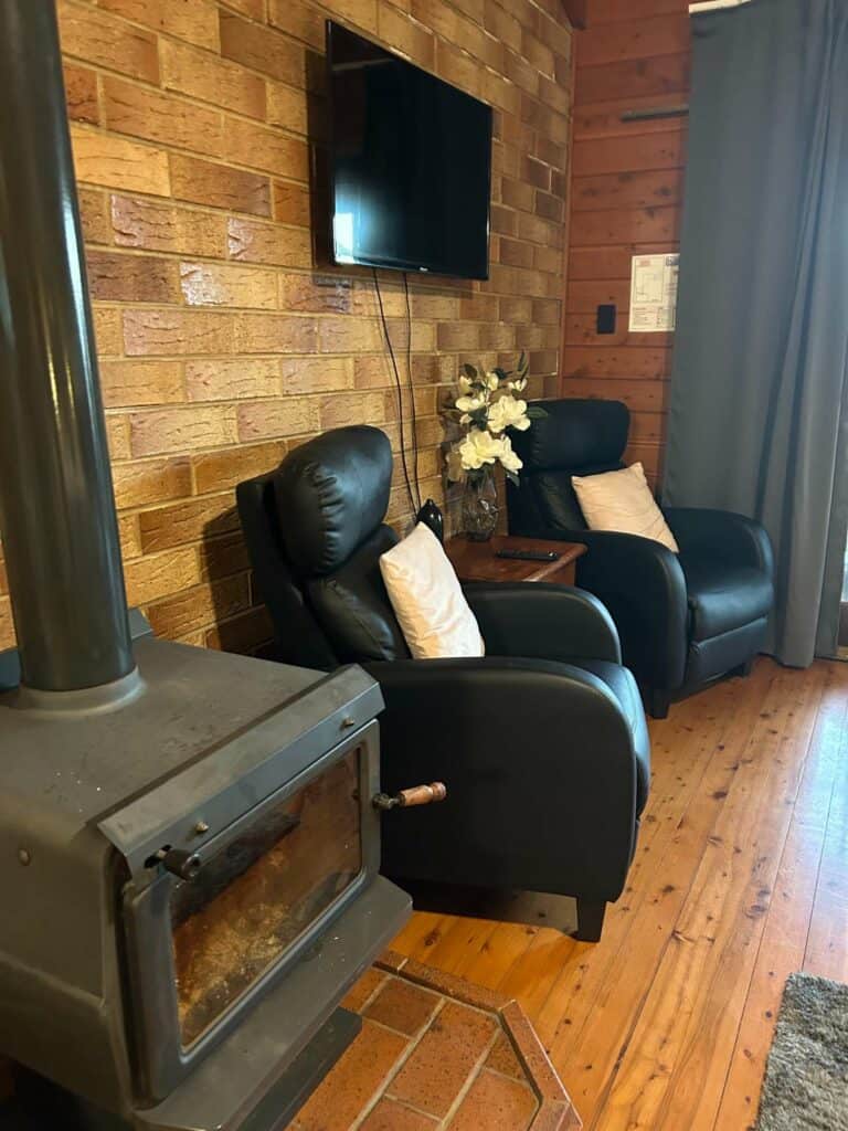 Sitting area and fireplace at Sabos on Severn in the Rose Cabin